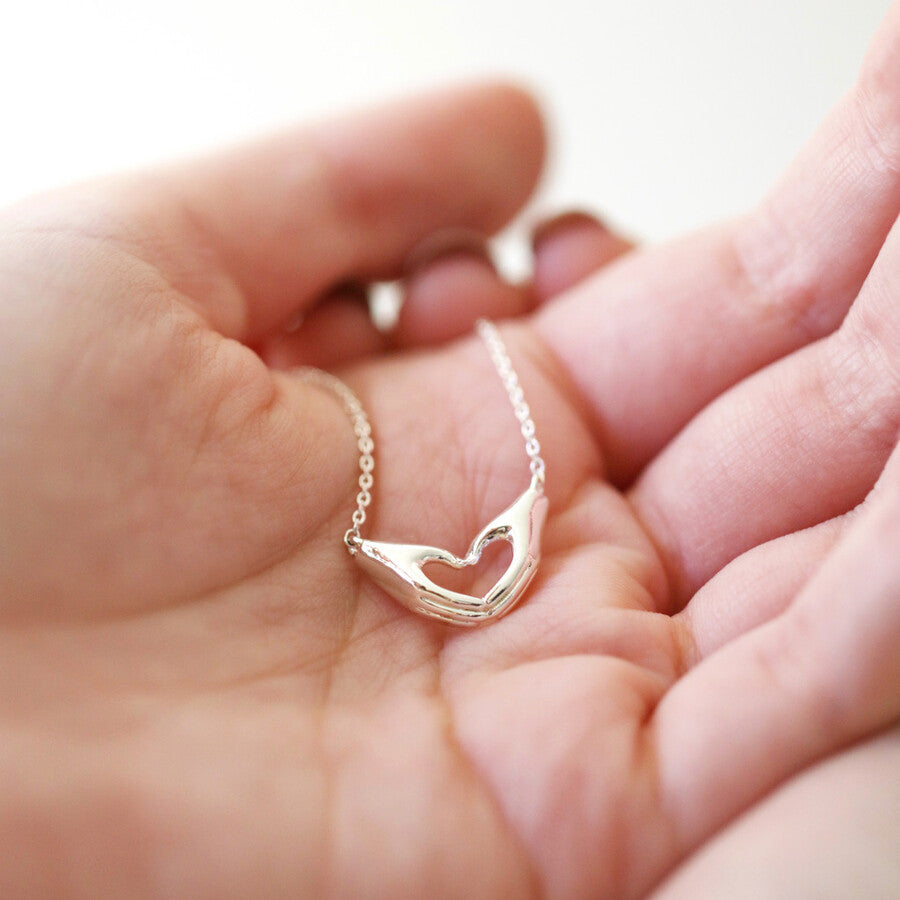 Heart Shaped Hands Necklace in Silver